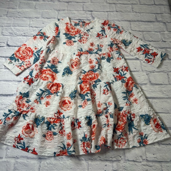 Franchesca’s Miami Little Girls Dress in White and Red Floral. Long
Sleeves. - Picture 1 of 7